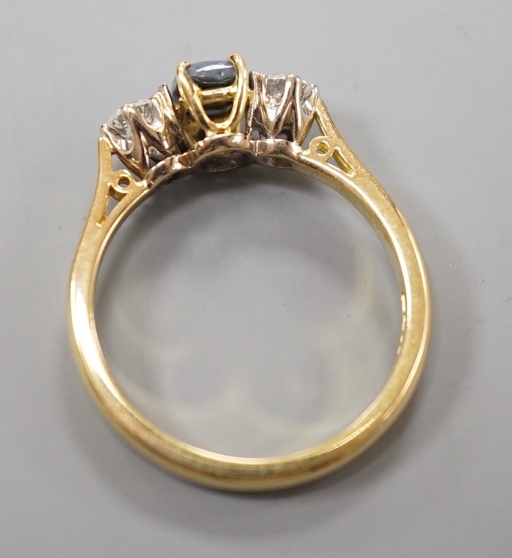 A modern 18ct gold, black opal and diamond set three stone ring, size Q, gross weight 4.6 grams